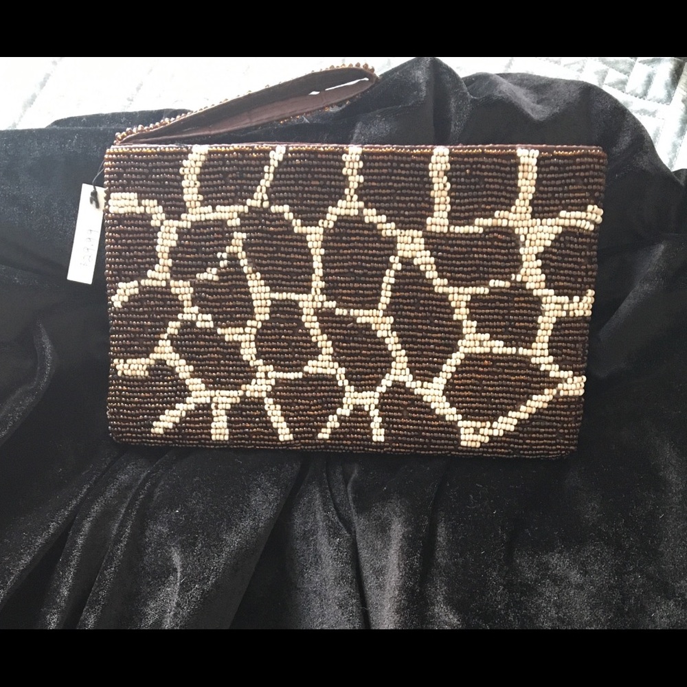 Small beaded wristlet bag.